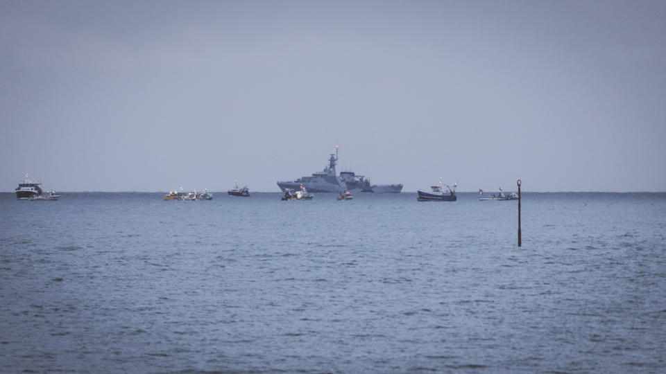 Fishing vessels at sea seen from the coast of Jersey, Thursday, May 6, 2021. French fishermen angry over loss of access to waters off their coast have gathered their boats in protest off the English Channel island of Jersey. The head of a grouping of Normandy fishermen said about 50 boats from French ports joined the protest Thursday morning and gathered their fleet off the Jersey port of St. Helier. (Oliver Pinel via AP)