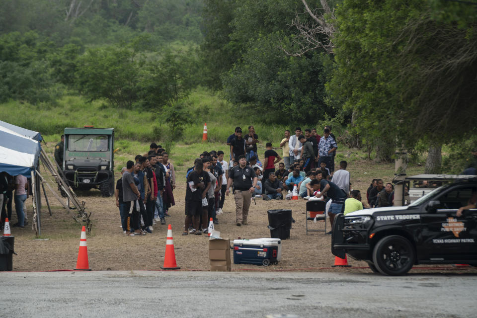 Migrants who recently crossed the border between the U.S. and Mexico are seen in Brownsville, Texas, Friday, May 5, 2023. (AP Photo/Veronica G. Cardenas)