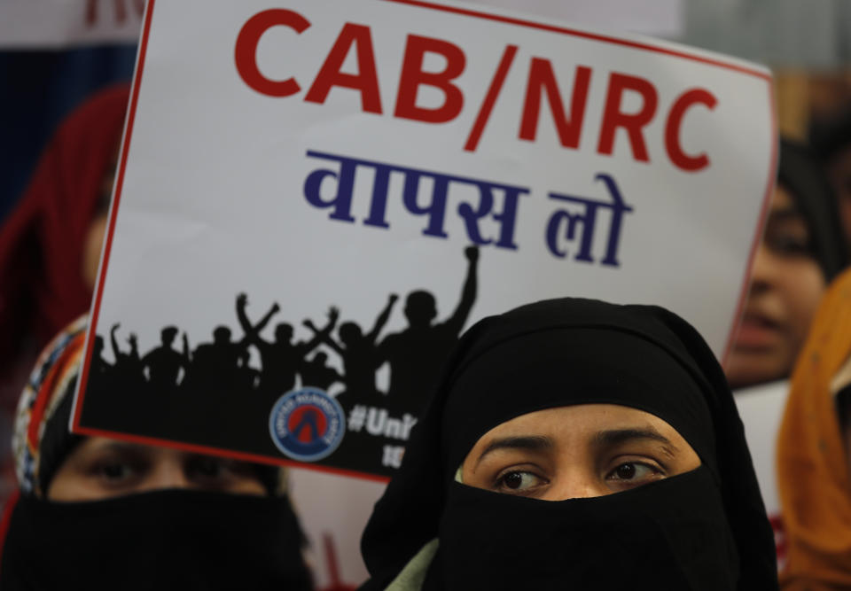 A student participates in a protest against new citizenship law with others in New Delhi, India, Tuesday, Dec. 24, 2019. Hundreds of students marched Tuesday through the streets of New Delhi to Jantar Mantar, an area designated for protests near Parliament, against the new citizenship law, that allows Hindus, Christians and other religious minorities who are in India illegally to become citizens if they can show they were persecuted because of their religion in Muslim-majority Bangladesh, Pakistan and Afghanistan. It does not apply to Muslims. (AP Photo/Manish Swarup)