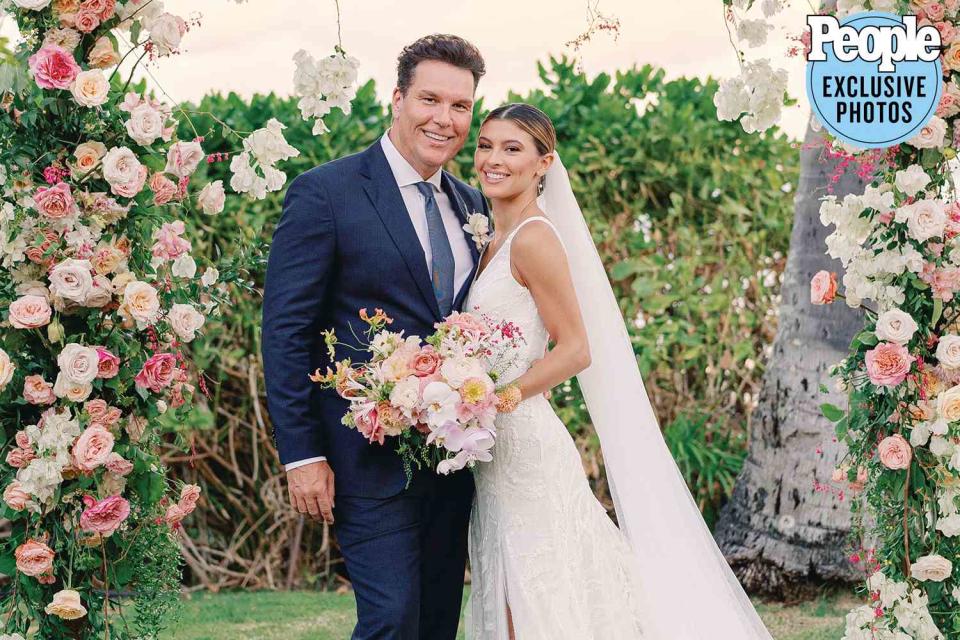 <p>Ashley Goodwin Photography</p> Dane Cook and Kelsi Taylor at their Sept. 23 wedding at a private estate in O’ahu, Hawaii.