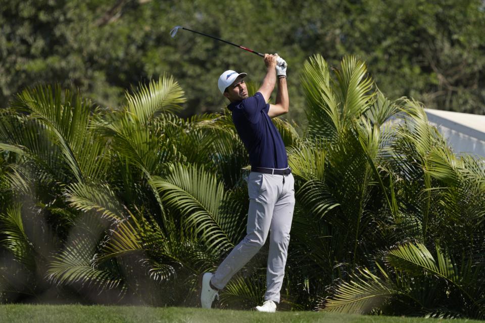 Alvaro Ortiz, of Mexico, watches his tee shot on the 10th hole during the third round of the Mexico Open golf tournament in Puerto Vallarta, Mexico, Saturday, Feb. 24, 2024. (AP Photo/Fernando Llano)