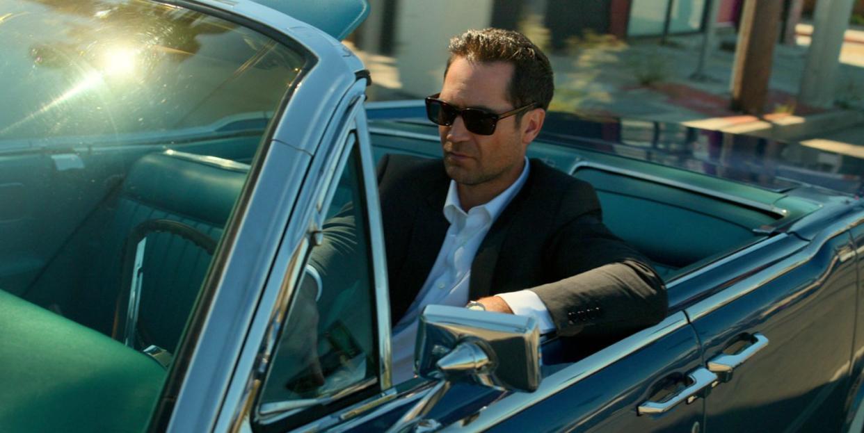 manuel garcia rulfo as mickey haller driving black convertible in the lincoln lawyer season 2, release date july 6