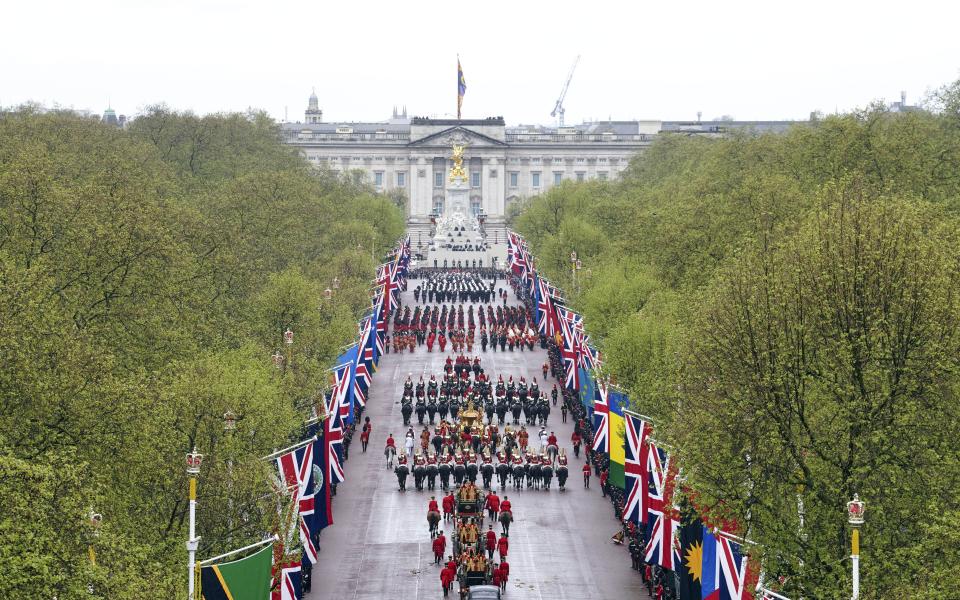 The Coronation Procession travels along The Mall following the coronation ceremony of King Charles III and Queen Camilla in central London.