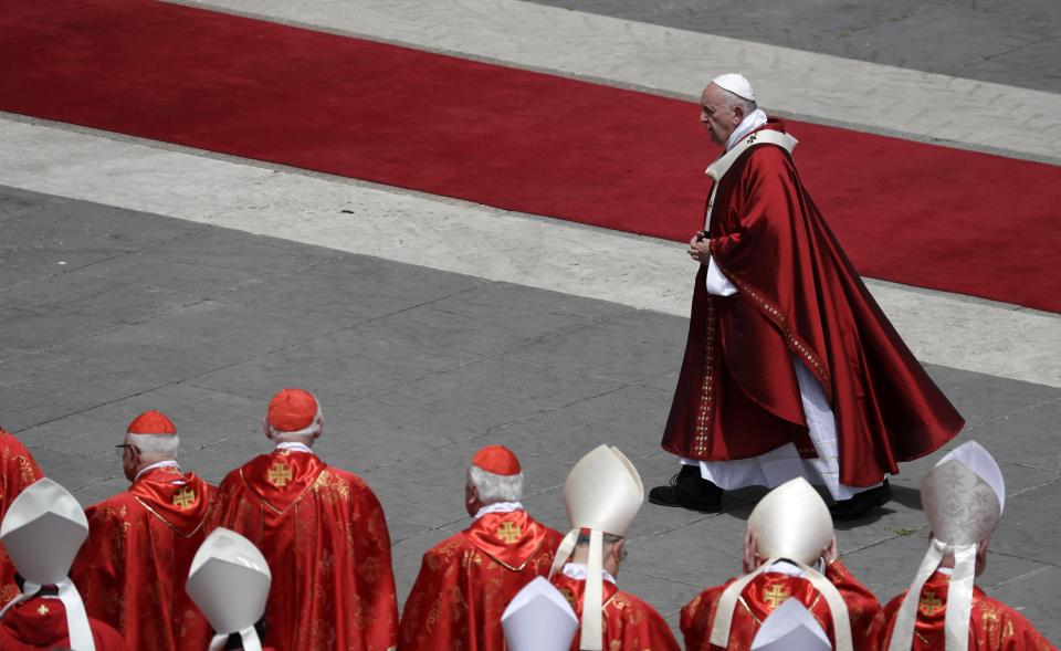 Pope Francis walks past cardinals after celebrating a Pentecost Mass in St. Peter's Square, at the Vatican, Sunday, June 9, 2019. The Pentecost Mass is celebrated on the seventh Sunday after Easter. (AP Photo/Gregorio Borgia)