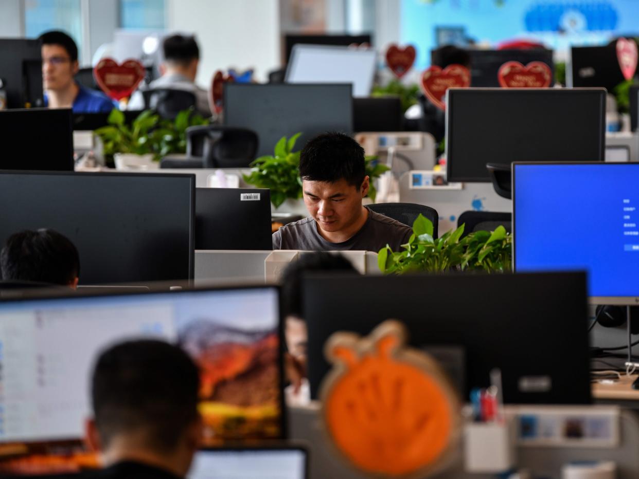 Alipay employees work in the Shanghai office building of Ant Group in Shanghai, on August 28, 2020.