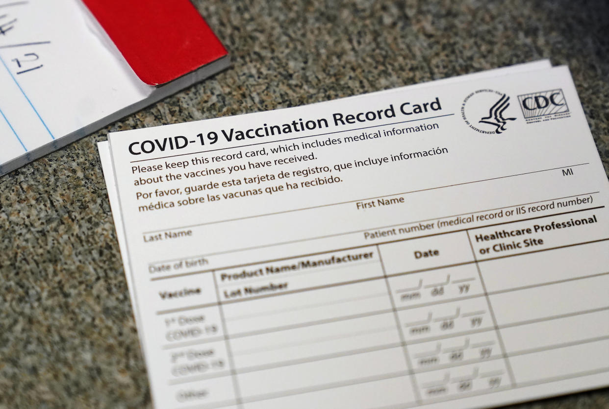 FILE - In this Dec. 24, 2020, file photo, a COVID-19 vaccination record card is shown at Seton Medical Center in Daly City, Calif. Los Angeles leaders are poised to enact one of the nation's strictest vaccine mandates, a sweeping measure that would require the shots for everyone entering a bar, restaurant, nail salon, gym or even a Lakers game. The City Council on Wednesday, Oct. 6, 2021, is scheduled to consider the proposal and most members have said they support it as a way of preventing further COVID-019 surges. (AP Photo/Jeff Chiu, File)