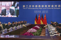 German Finance Minister Olaf Scholz, fourth from left, speaks during the China-Germany High Level Financial Dialogue with Chinese Vice Premier Liu He at the Diaoyutai State Guesthouse in Beijing, Friday, Jan. 18, 2019. (AP Photo/Andy Wong, Pool)