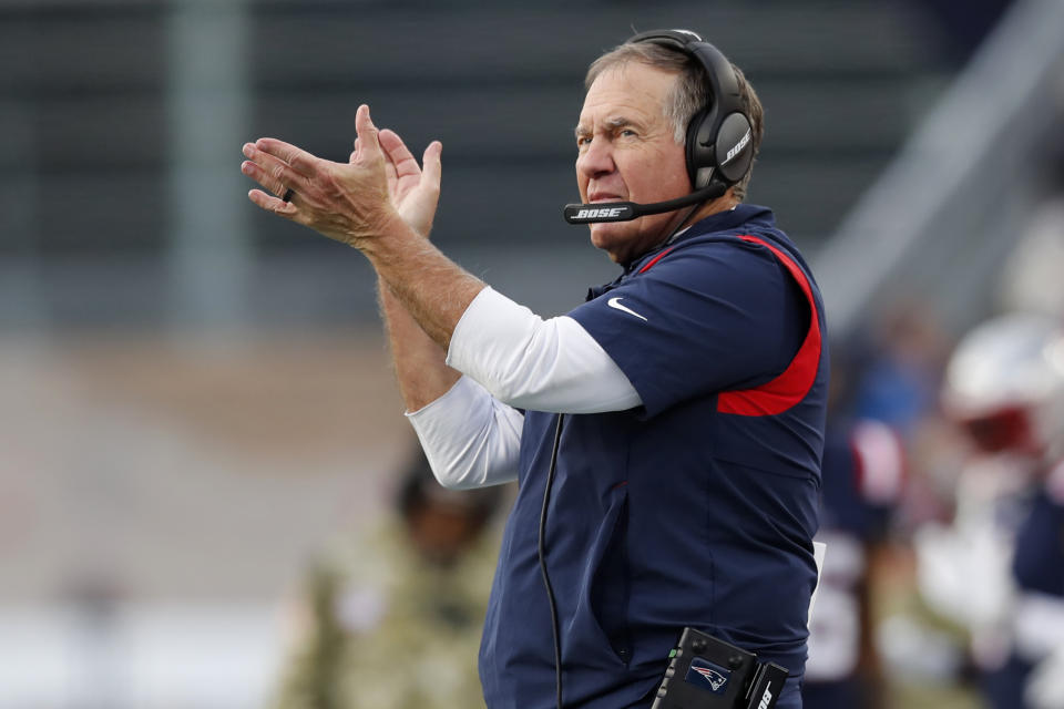 New England Patriots head coach Bill Belichick applauds towards his players on the field during the second half of an NFL football game against the Cleveland Browns, Sunday, Nov. 14, 2021, in Foxborough, Mass. (AP Photo/Michael Dwyer)