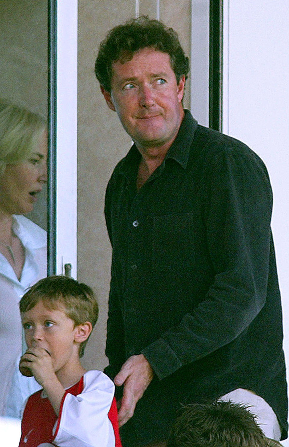 Former Daily Mirror editor Piers Morgan takes his seat ahead of the English premier league soccer match between Arsenal and Leicester City at Highbury, London, May 15, 2004. Morgan was sacked after the newspaper conceded that photos they had published of British soldiers abusing an Iraqi were fake. NO ONLINE/INTERNET USAGE WITHOUT FAPL LICENCE. FOR DETAILS SEE WWW.FAPLWEB.COM REUTERS/Mike Finn-Kelcey  MFK/DBP/ACM