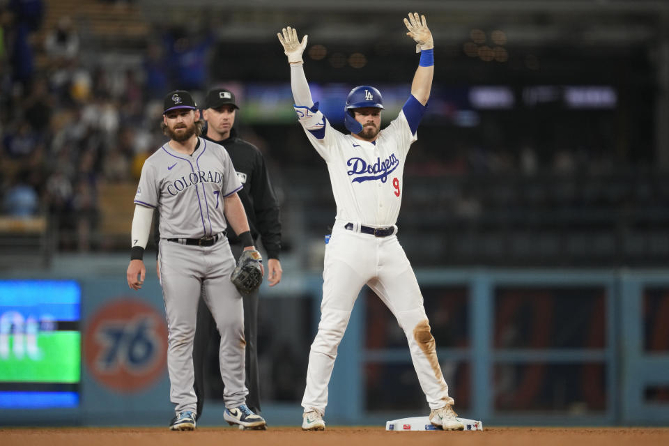 Los Angeles Dodgers' Gavin Lux (9) celebrate after a double during the eighth inning of a baseball game against the Colorado Rockies in Los Angeles, Friday, May 31, 2024. (AP Photo/Ashley Landis)