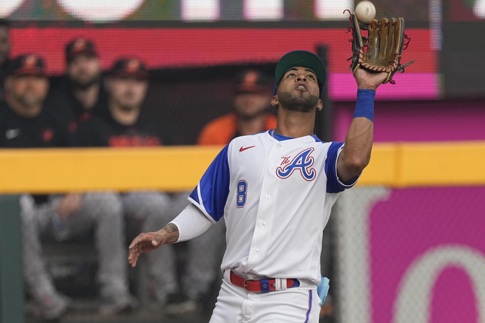 Atlanta Braves left fielder Eddie Rosario makes a catch to retire Baltimore Orioles' Gunnar Henderson in the second inning of a baseball game Saturday, May 6, 2023, in Atlanta. (AP Photo/John Bazemore)