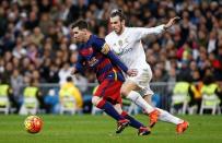 Real Madrid's Gareth Bale in action with Barcelona's Lionel Messi. Reuters / Paul Hanna