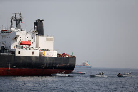 UAE Navy boats are seen next to Al Marzoqah, Saudi Arabian tanker, off the Port of Fujairah, UAE May 13, 2019. REUTERS/Satish Kumar