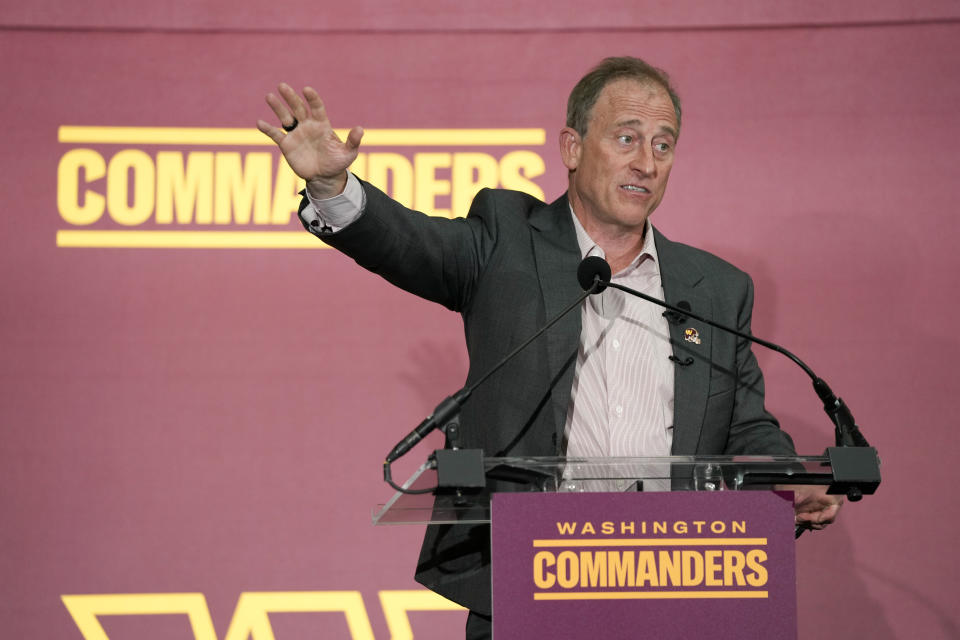 FILE - Josh Harris, the leader of a group buying the Washington Commanders, speaks at an introductory NFL football news conference at FedEx Field in Landover, Md., Friday, July 21, 2023. It was noticeable when new Washington Commanders owners Josh Harris and Magic Johnson referred to the old Redskins name in their opening news conference. (AP Photo/Alex Brandon, File)