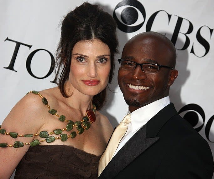 Close-up of Idina and Taye smiling at a media event