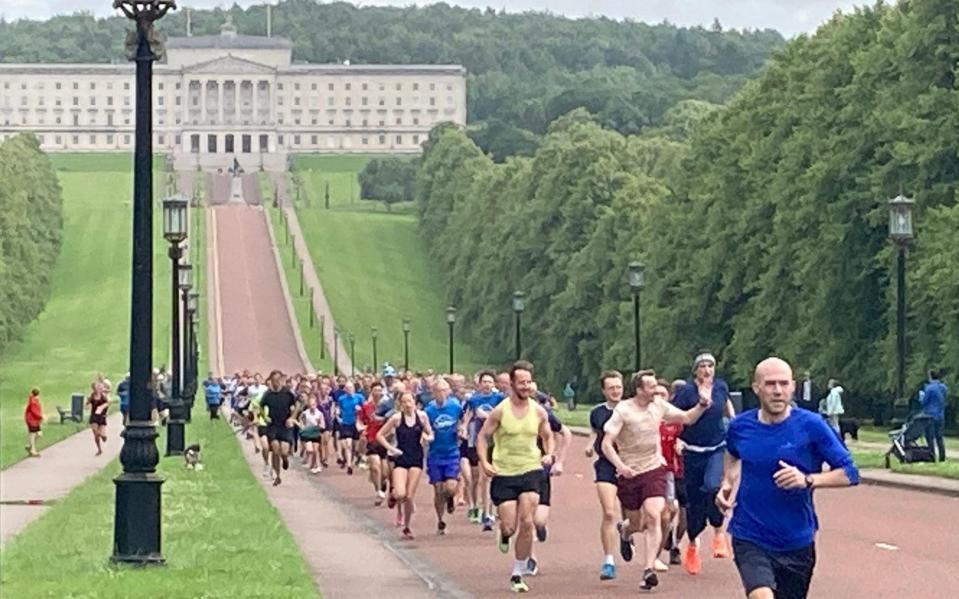 Runners take part in a Parkrun event to celebrate the 75th anniversary of the NHS at Stormont in Belfast