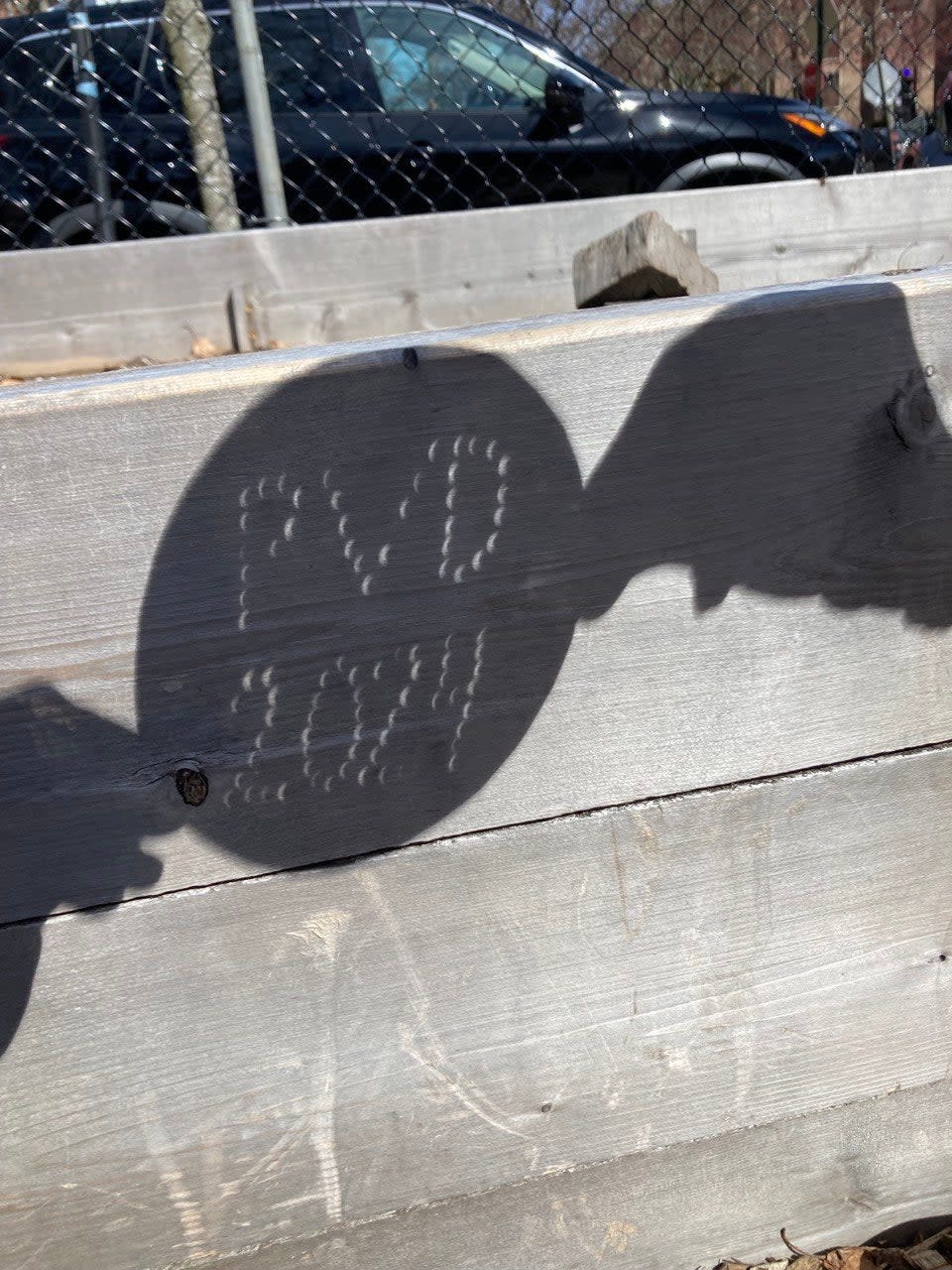 A projection of the solar eclipse on a playground in Providence, Rhode Island, on 8 April, 2024 (Angela Early)