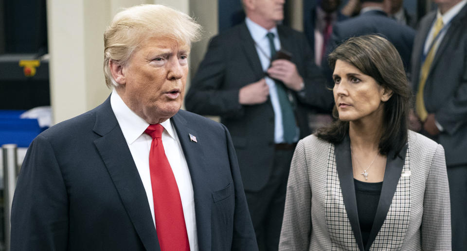 President Trump speaks to members of the media as he arrives with Nikki Haley, the U.S. ambassador to the United Nations, at the U.N. General Assembly last month. (AP Photo/Craig Ruttle)