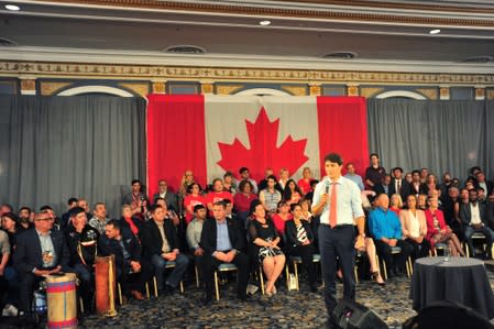 Canada's Prime Minister Justin Trudeau answers a question about pictures of him in blackface during a town hall meeting at an election campaign stop in Saskatoo