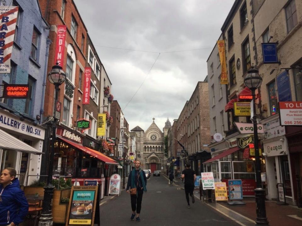 shot of a street in dublin ireland lined with shops