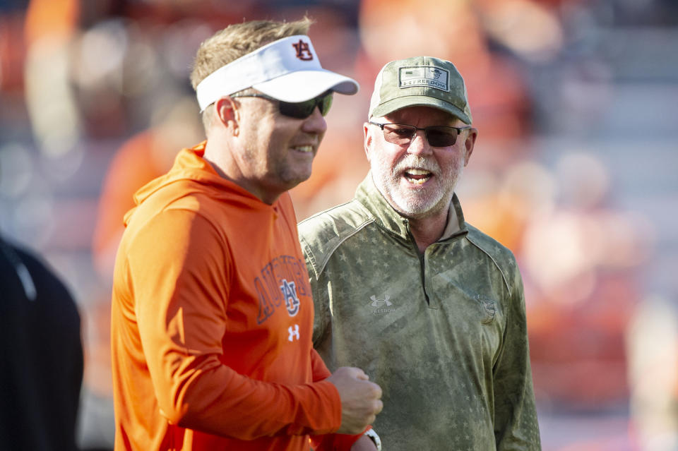 Jerry Kill (right) and New Mexico State are in the New Mexico Bowl after a season that included a win over Hugh Freeze's Auburn Tigers. (Michael Chang/Getty Images)