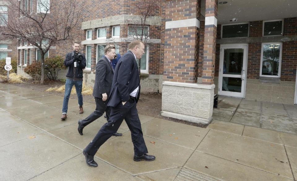 Sen. Todd Weiler, R-Woods Cross, left, and Sen. Jim Dabakis, D-Salt Lake City, arrive at the Uintah Elementary School before stoping in for school lunch Thursday, Jan. 30, 2014, in Salt Lake City. A school district apologized Thursday to outraged parents after about 30 students at a Salt Lake City school had their lunches thrown out because of outstanding balances on their food accounts. Salt Lake City School District spokesman Jason Olsen said the district is investigating what happened at Uintah Elementary and working to make sure it doesn't happen again. "This was a mistake. This was handled wrong," Olsen said during a news conference outside the school. (AP Photo/Rick Bowmer)