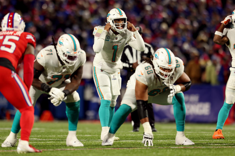 ORCHARD PARK, NEW YORK - DECEMBER 17: Tua Tagovailoa #1 of the Miami Dolphins signals during the third quarter against the Buffalo Bills at Highmark Stadium on December 17, 2022 in Orchard Park, New York. (Photo by Bryan M. Bennett/Getty Images)