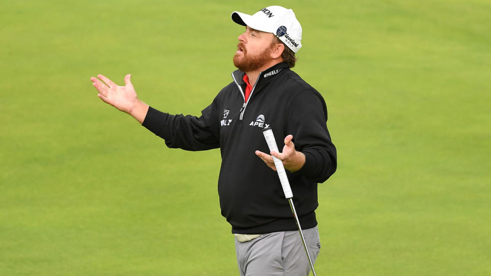 JB Holmes 'celebrates' after finishing his final round at the British Open. (Photo by ANDY BUCHANAN/AFP/Getty Images)