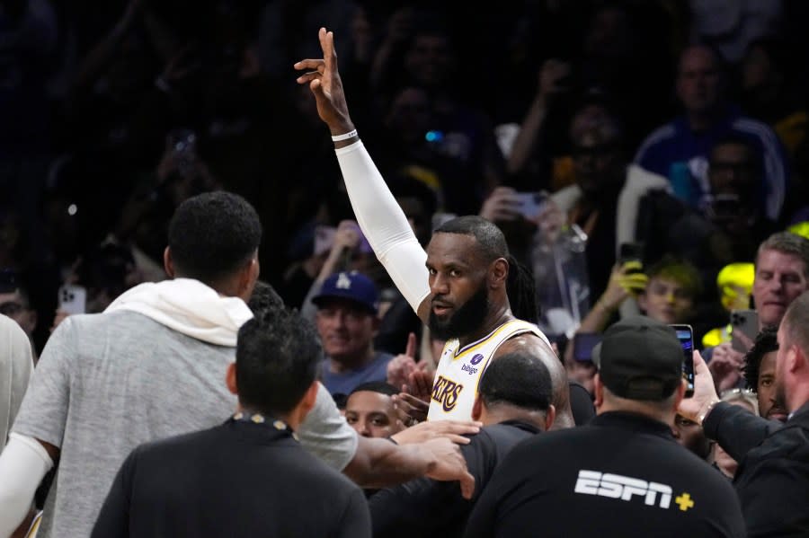 Los Angeles Lakers forward LeBron James acknowledges fans after scoring to become the first NBA player to reach 40,000 points in a career during the first half of an NBA basketball game Saturday, March 2, 2024, in Los Angeles. (AP Photo/Mark J. Terrill)