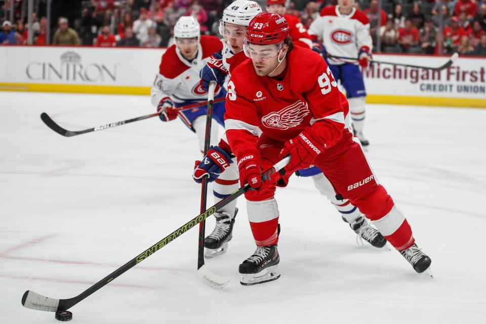 Detroit Red Wings right wing Alex DeBrincat (93) skates against Montreal Canadiens defenseman Lane Hutson (48)m during the first period at Little Caesars Arena in Detroit on Monday, April 15, 2024.