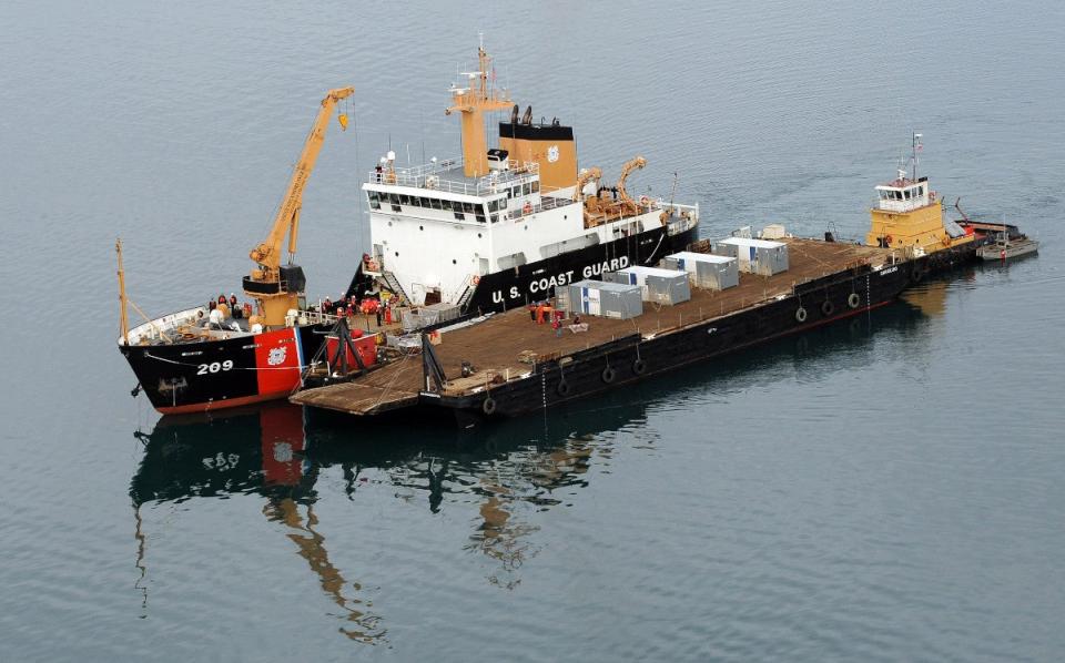 USCGC <em>Sycamore</em>, anchored alongside a barge, while participating in the U.S. military exercise Arctic Edge 2012. <em>USCG</em>