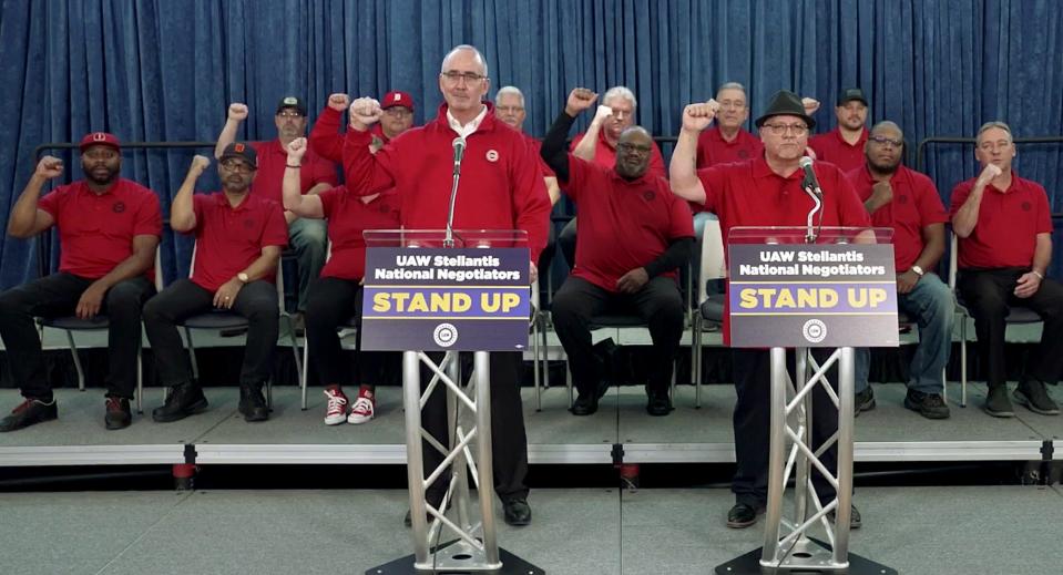 In the frame capture from video, UAW President Shawn Fain, left and UAW Vide President Rich Boyer, close their speech saying, "remember UAW family, an open hand can be broken, but a closed fist in unity cannot," after giving an update on the details of the tentative agreement the UAW announced with Stellantis during a Facebook Live event on Thursday, November 2, 2023.