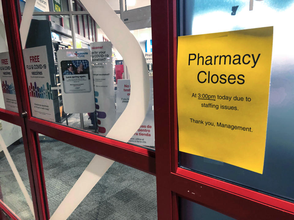 Image: A sign is posted outside a CVS pharmacy on Dec. 2, 2021 in Indianapolis (Tom Murphy / AP file)