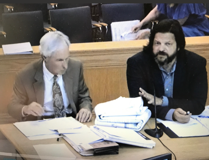 Applicant attorney James Jaworski and engineer Tony Diggan with 38-page map for Sheraton Crossroads conversion project..