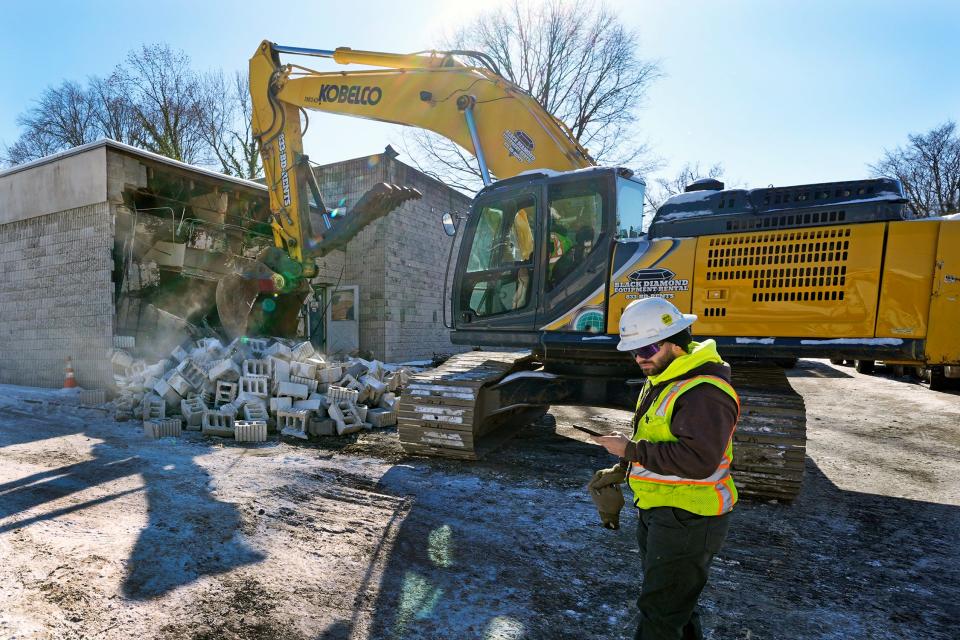 Workers begin demolition Wednesday, Jan. 17, 2023, at the Tree of Life building in Pittsburgh, the site of the deadliest antisemitic attack in U.S. history, as part of the effort to reimagine the building to honor the 11 people who were killed there in 2018.