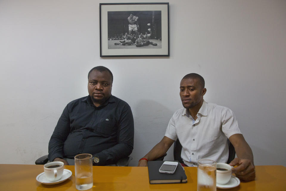 In this Thursday, March 30, 2017 photo, Samuel Jack, left, president of the African Students' Association, and Ezeugo Nnamdi Lawrence, a coordinator of African students, sit for an interview with The Associated Press in New Delhi, India. Tens of thousands of Africans live and study in India, drawn by better education and work opportunities. But racism and prejudice is a daily battle for Africans across India. "We face street aggression, abuses. We also face difficulty in getting accommodation, we face difficulty in naturally integrating with the local community," said Samuel Jack. (AP Photo/Manish Swarup)