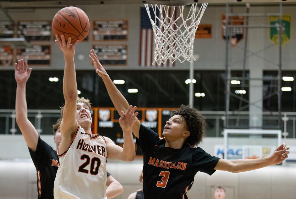 Hoover’s Zachary Braucher takes a shot over Massillon’s Chris Knight on Friday, Jan. 6, 2023.