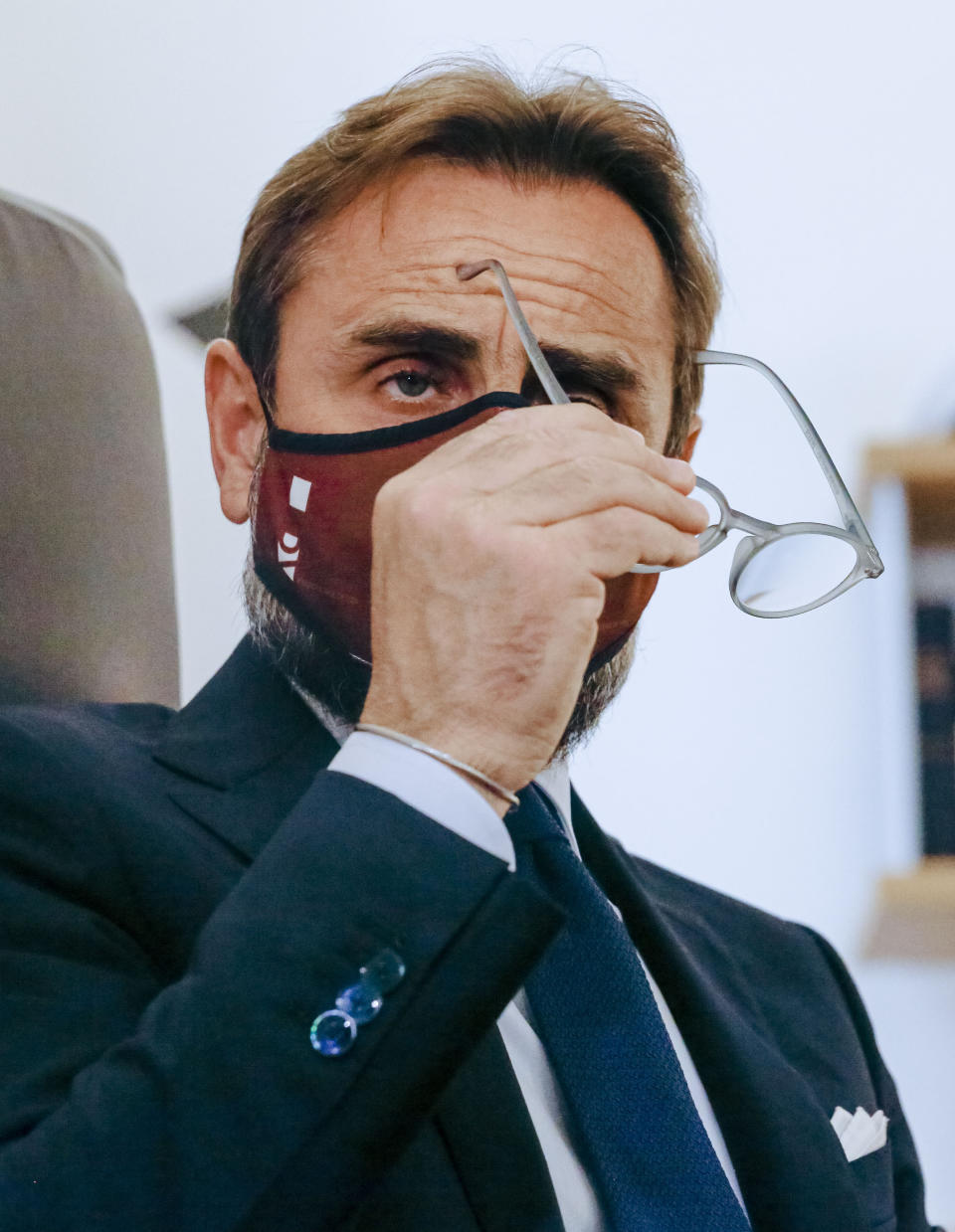 Lawyer Roberto De Vita, representing WHO's deputy director General Ranieri Guerra, speaks during an interview with The Associated Press at his law firm in Rome, Monday, May 10, 2021. A top World Health Organization official has strongly denied making false statements to Italian prosecutors about a spiked U.N. report into Italy’s coronavirus response, doubling down on his assertions in court documents obtained by The Associated Press. Dr. Ranieri Guerra, a WHO special adviser, outlined his position in a 40-page response, with a 495-page annex, to prosecutors who placed him under investigation last month for having allegedly made false statements to them when he voluntarily went to be questioned Nov. 5. (AP Photo/Domenico Stinellis)