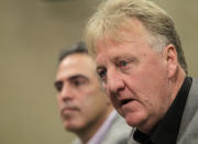 Larry Bird, right, talks about stepping down as president of the Indiana Pacers as new general manager Kevin Pritchard listens during an announcement by the NBA basketball team in Indianapolis, Wednesday, June 27, 2012. Donnie Walsh was named as president. (AP Photo/Michael Conroy)