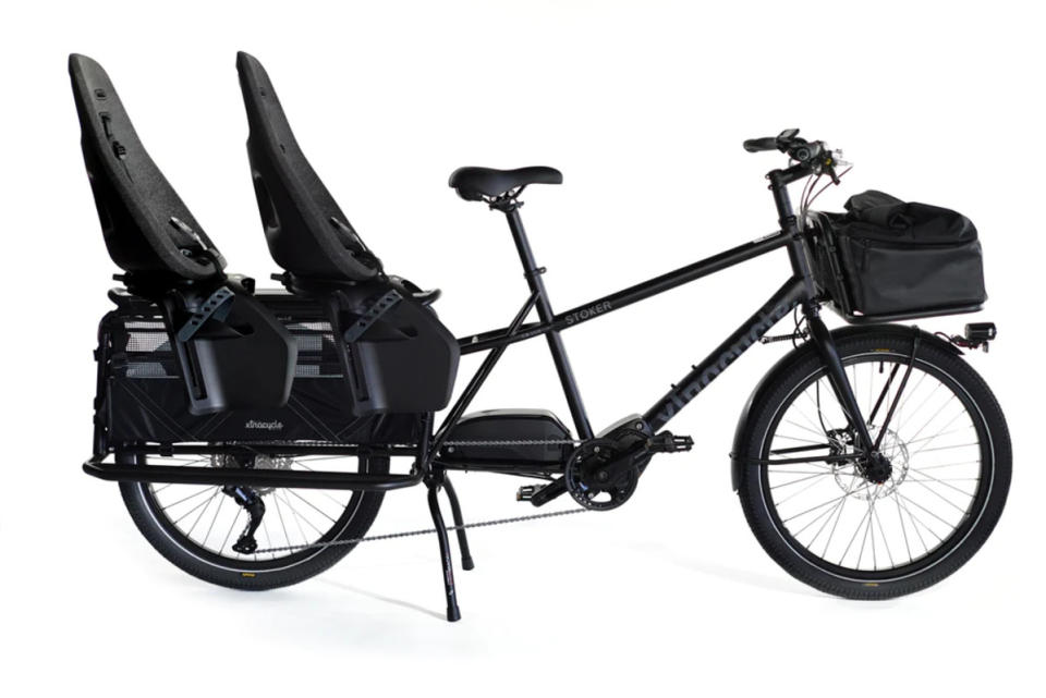 <p>XtraCycle</p>Xtracycle RFA<ul><li>Battery Power: 630 Wh</li><li>Motor Size: 250W (85 Nm)</li><li>Range: 30-60 Miles</li><li>Payload: 400 lbs</li><li>Class 1 (up to 20mph, pedal-assist only)</li></ul><p>The Xtracycle RFA embodies versatility in the e-bike realm. With a 630Wh battery and a robust 250W (85 Nm) motor, it strikes the perfect balance between power and efficiency. Its unique feature of adjustable frame size and length sets it apart, offering adaptability for riders of different heights. Remarkably compact, the RFA matches the length of standard bikes, enhancing maneuverability in urban environments. </p><p>Boasting a generous payload capacity of 400 lbs and many options for racks, child seats or an adult passenger, it's a true workhorse. Operating as a Class 1 e-bike, reaching speeds up to 20mph with pedal-assist only, the Xtracycle RFA delivers a range of 30-60 miles, depending on specific conditions. Elevate your cycling experience with the Xtracycle RFA – a compact, adaptable, and 'Ready For Anything' companion.</p>