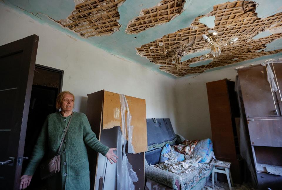 Local resident Valentina, 63, reacts inside her house, which was damaged by recent shelling in the course of Russia-Ukraine conflict, in the town of Horlivka (Gorlovka) in the Donetsk region (REUTERS)