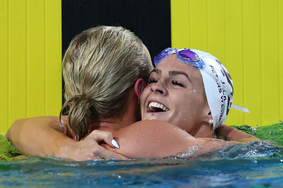 BRISBANE, AUSTRALIA - JUNE 12: Ariarne Titmus of Queensland is congratulated by Shayna Jack of Queensland after winning the Women’s 200m Freestyle Final in a new world record time of 1:52.23 during the 2024 Australian Swimming Trials at Brisbane Aquatic Centre on June 12, 2024 in Brisbane, Australia. (Photo by Quinn Rooney/Getty Images)