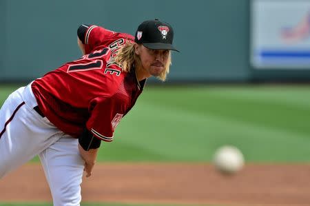 FILE PHOTO: Mar 7, 2019; Salt River Pima-Maricopa, AZ, USA; Arizona Diamondbacks starting pitcher Zack Greinke (21) throws during the second inning against the Cleveland Indians at Salt River Fields at Talking Stick. Mandatory Credit: Matt Kartozian-USA TODAY Sports