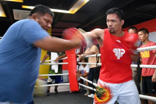 Manny Pacquiao spars with childhood friend and long-time assistant trainer Buboy Fernandez. July's bout will be the 'basis' for a retirement call, said the fighter