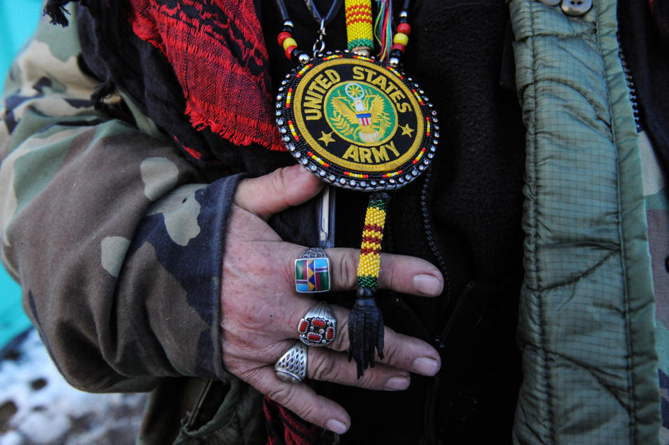 Steve Perry from the Odawa tribe displays his Army medal for the camera in Oceti Sakowin camp.