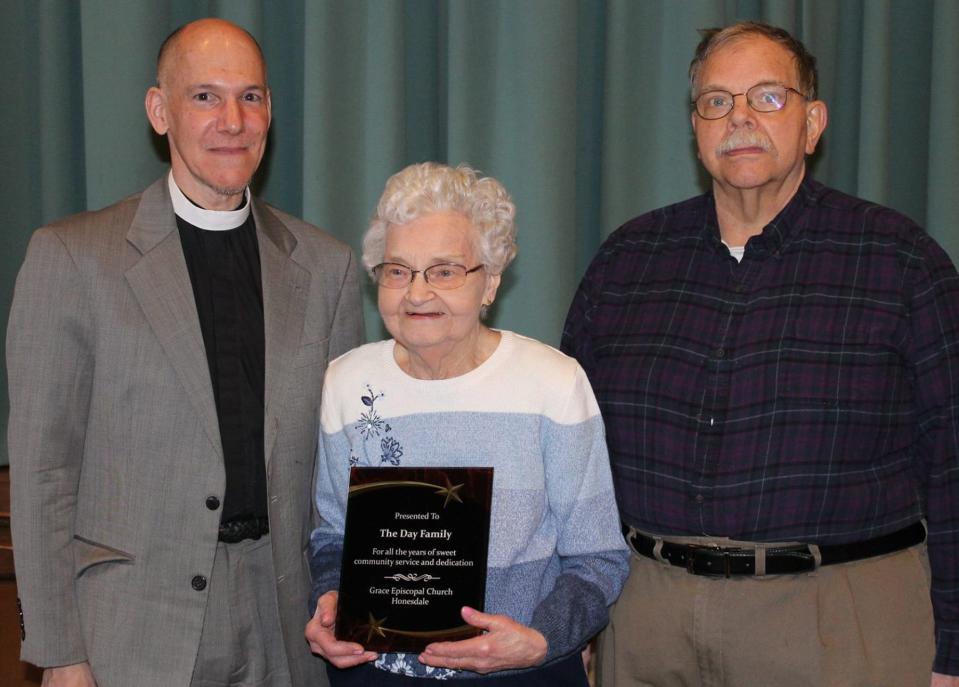 Doris Day recently celebrated her 100th birthday. The longtime owner of Day's Bakery in Honesdale is pictured here with her late son Eddie (right) and Grace Episcopal Pastor Edward Erb (right) accepting an award for community service.