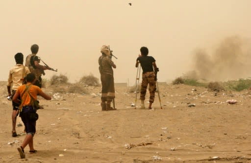 Yemeni pro-government forces look on to the south of Hodeida airport on June 15, 2018, three days into a Saudi-backed offensive to take Hodeida city from Huthi rebels