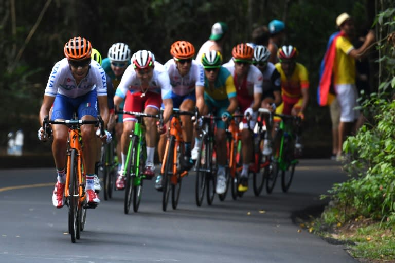 Italy's Fabio Aru (L) leads the pack during the Rio 2016 Olympic Games on August 6, 2016