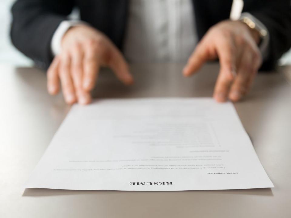 Close up image of resume at desk of employer