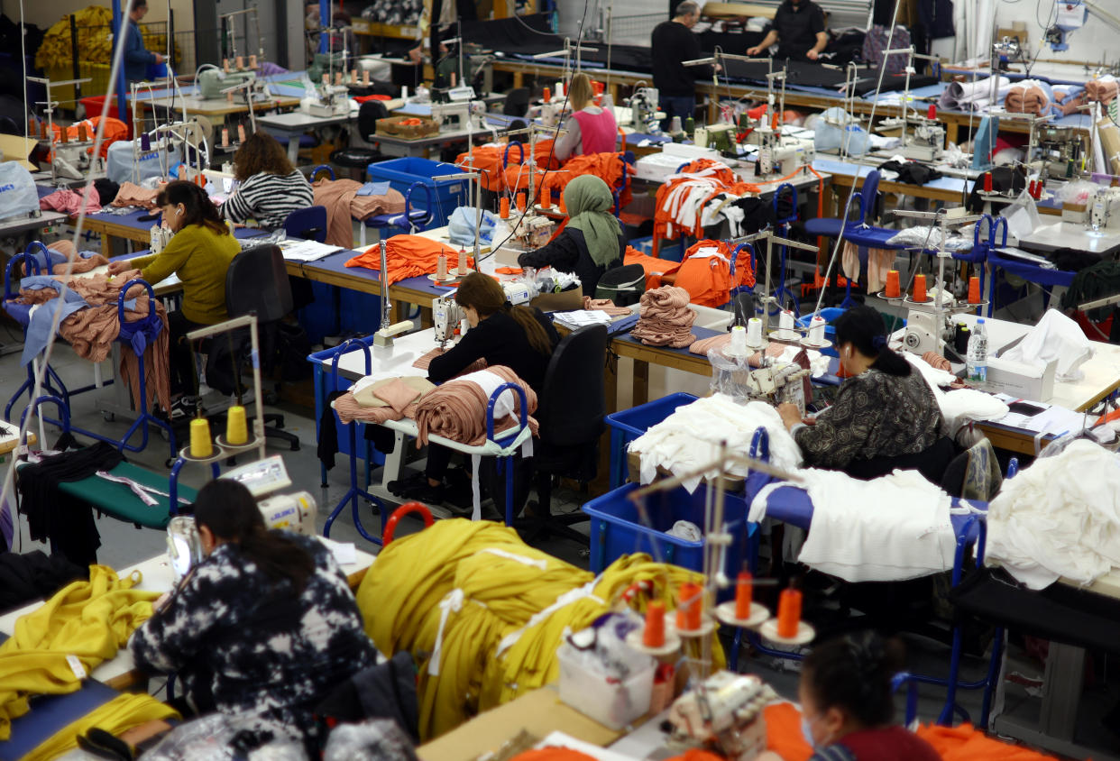 Living wage Machinists are seen at work on the factory floor of Fashion-Enter Ltd in London, Britain, February 15, 2023. REUTERS/Hannah McKay